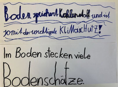 Plakat von Kindern gestaltet, wo's um den Boden und seine Bodenschätze geht.